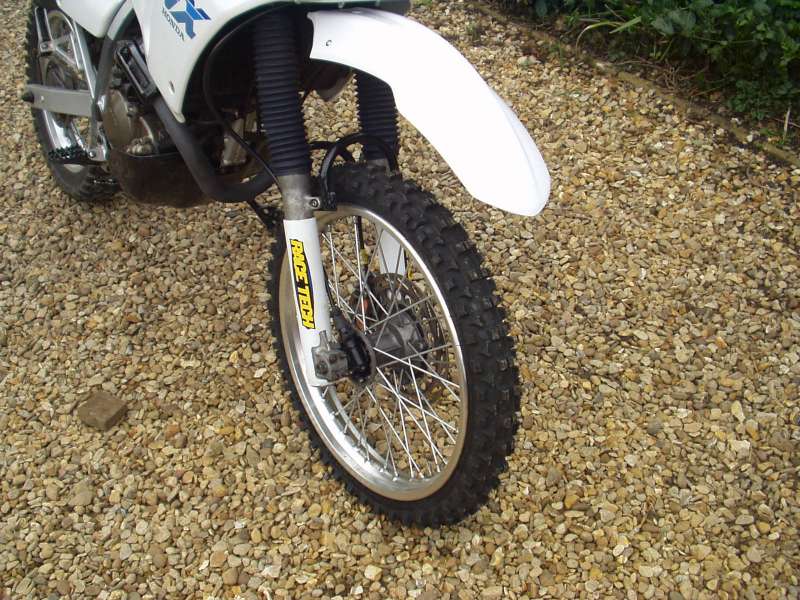 HondaNXwithrespokedwheelanda70-100x19goldentyreroadlegal2.JPG