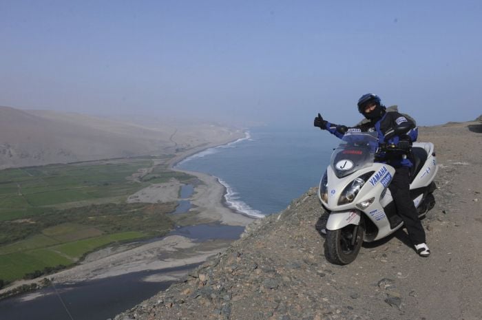 Shinji Kazama on his Yamaha scooter