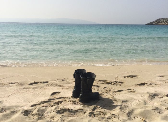 Motorcycle boots on a beach