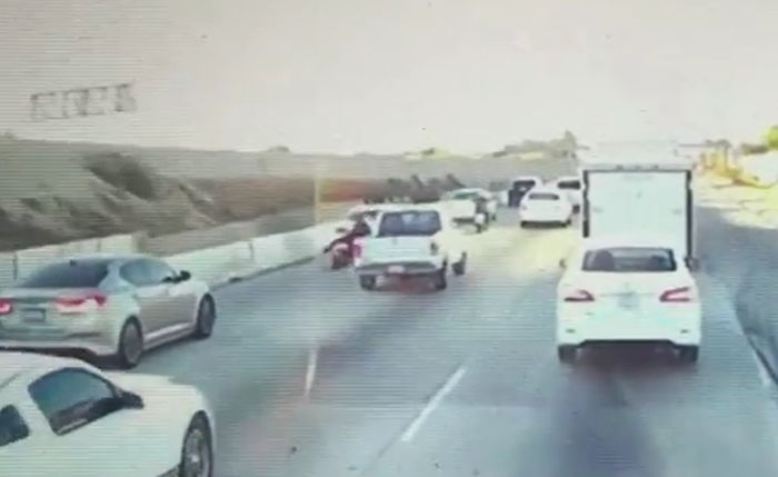 Pickup swerves into motorcyclist
