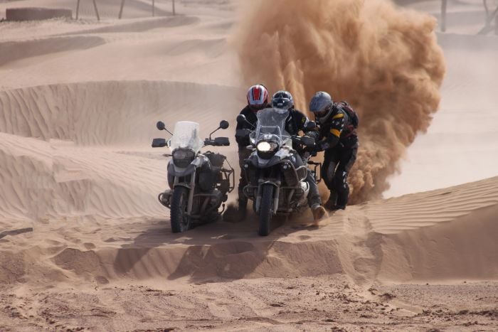 Riding sand dunes, Morocco