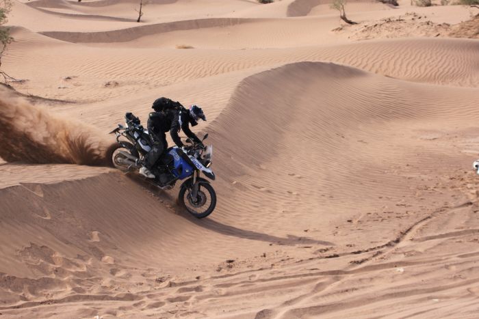 Riding sand dunes, Morocco