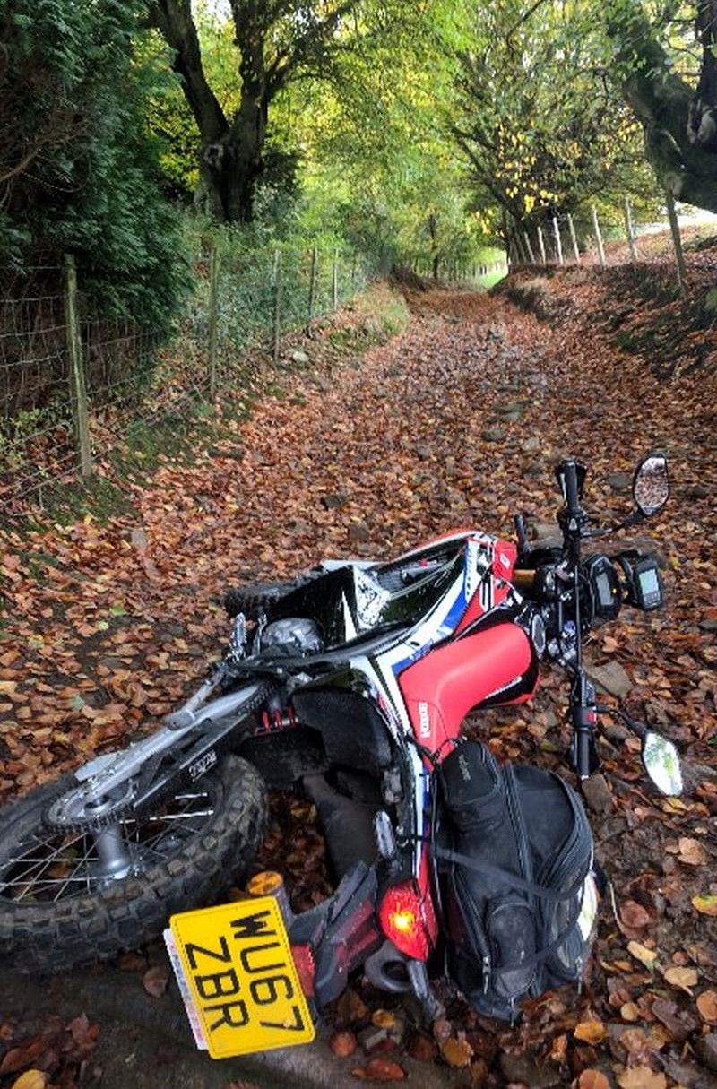 Dropped motorcycle on off-road track