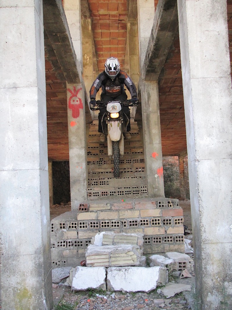 Rididng a motorcycle down a set of stairs