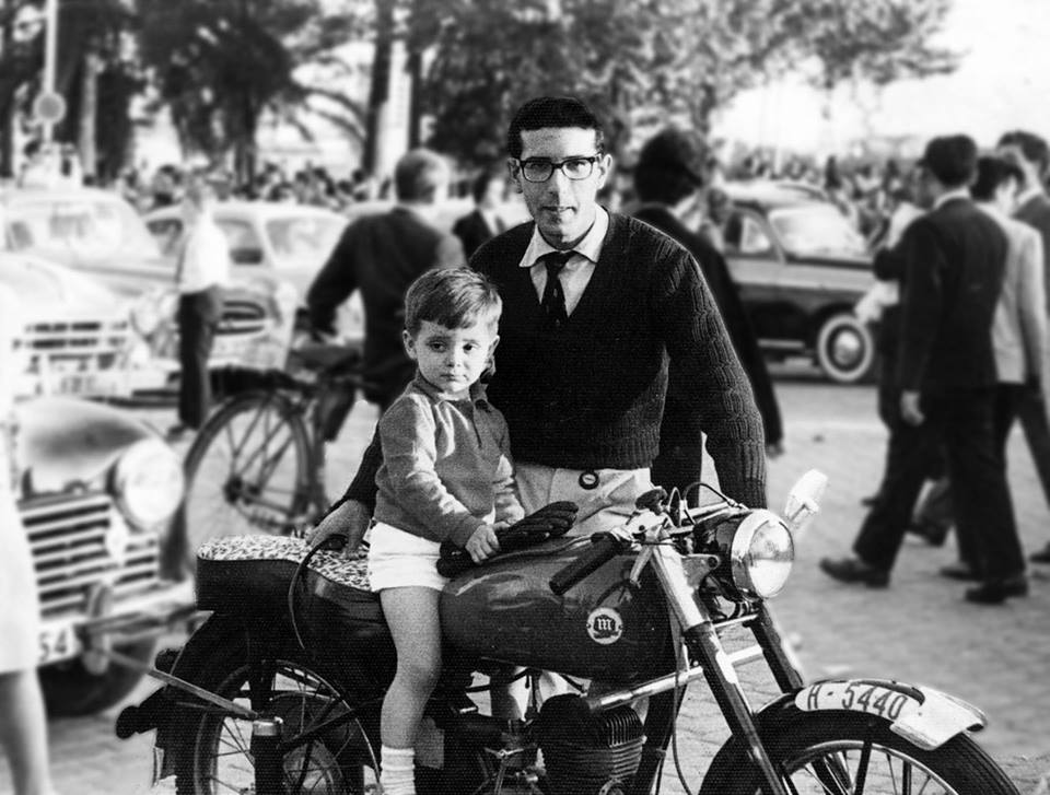 Child on motorcycle with Father