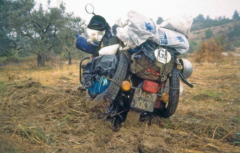 A motorcycle in a muddy field