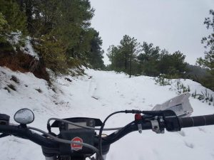 Riding a motorcycle in the snowy weather