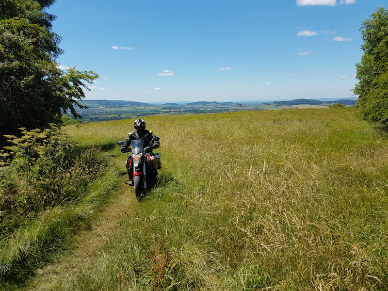 A 125cc motorcycle on a green lane