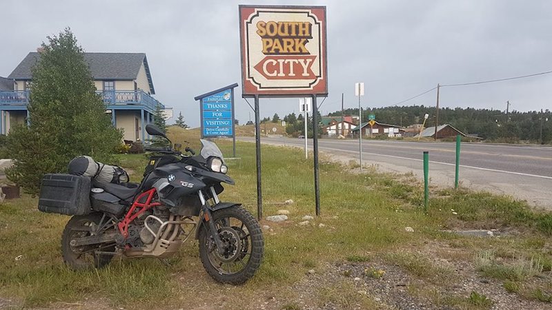 A BMW GS in front of the South Park city sign