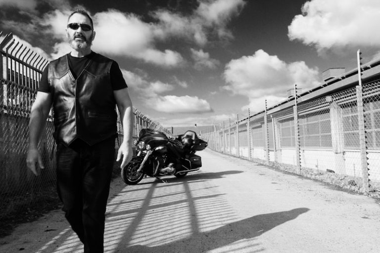 Alun Davies walking away from the Harley Davidson Ultra Limited