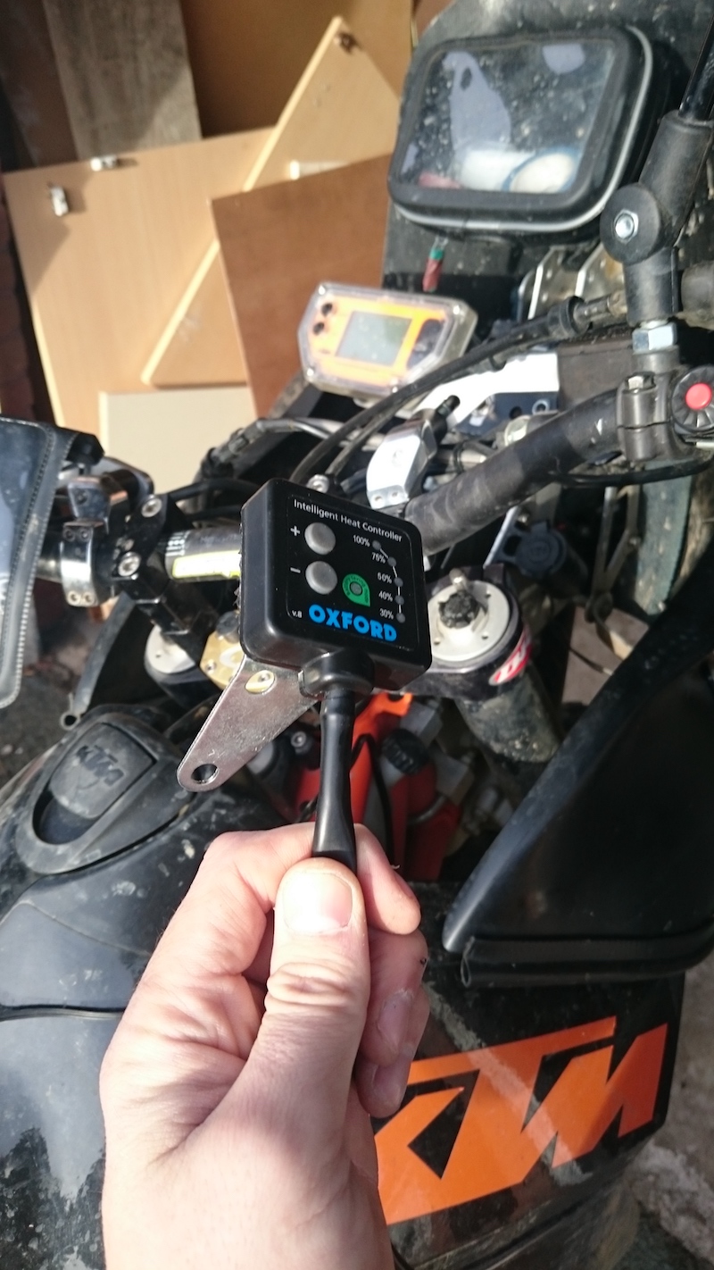 Mounting a heated grips controller