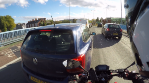Watch: Does this driver squirt screen wash at filtering biker on purpose?