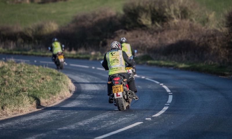 Two motorcyclists learning how to ride on the Isle of Wight