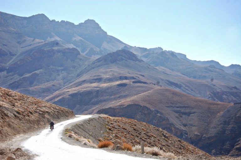 Motorcyclist riding mountains in India