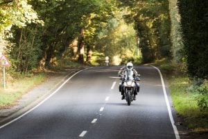 A motorcycle on a road in the South Downs