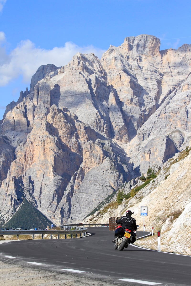 a ducati on a mountain road in the Dolomites
