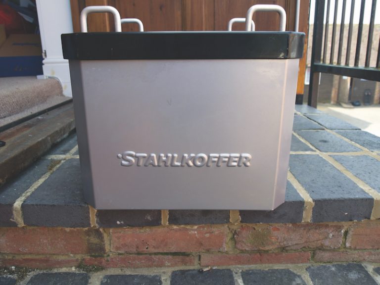 Stahlkoffer Aluminium Top Box on a wall