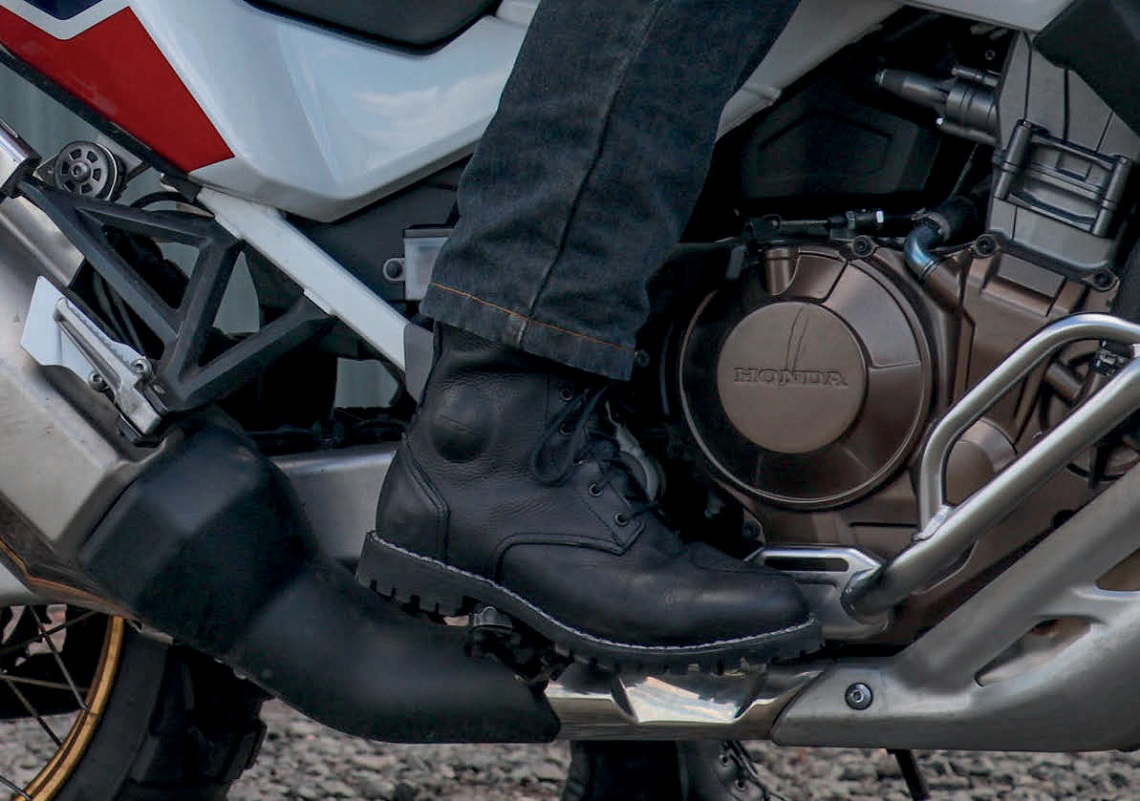 What type of shoes should be worn when riding motorcycles and in