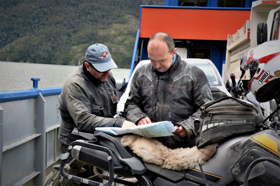 Checking the map. Ferry Padre Antonio Rochi between Puerto Yungay and Rio Bravo