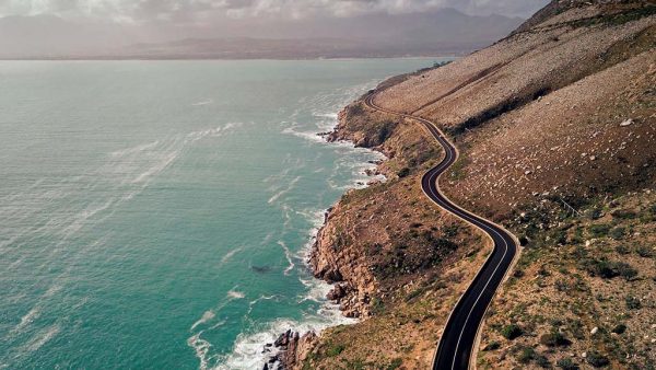 Clarence Drive, South Africa South of Cape Town overlooking the Atlantic Ocean is Chapman’s Peak Drive, a popular road among local bikers and visitors to South Africa alike, but a few miles away on the east coast of False Bay is Clarence Drive, which offers even better riding