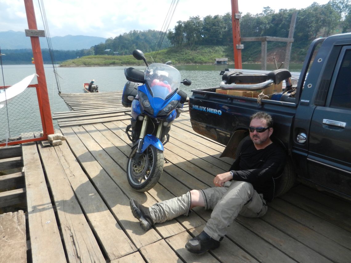 A small home-made ferry towards Nan in the North East of Thailand