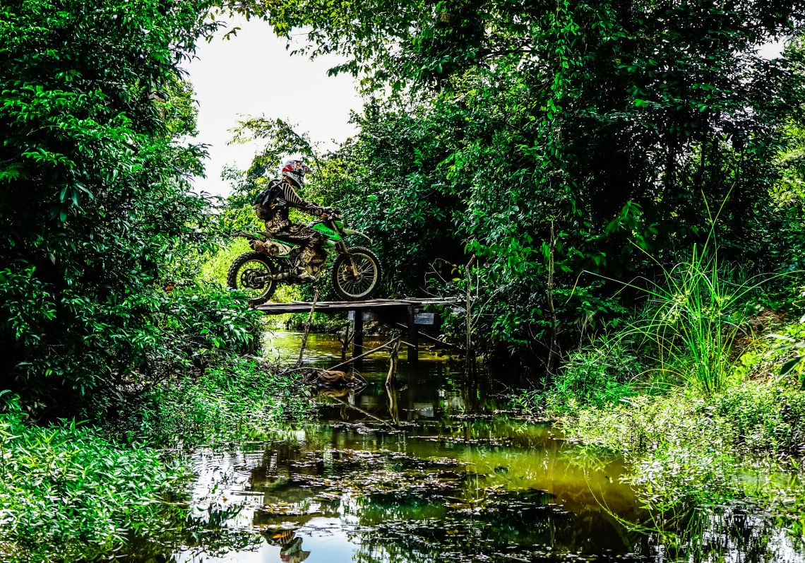 Andrew crosses a bridge deep in the jungle on Route-66