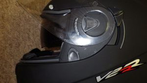 Visor release and inner sun shield lever